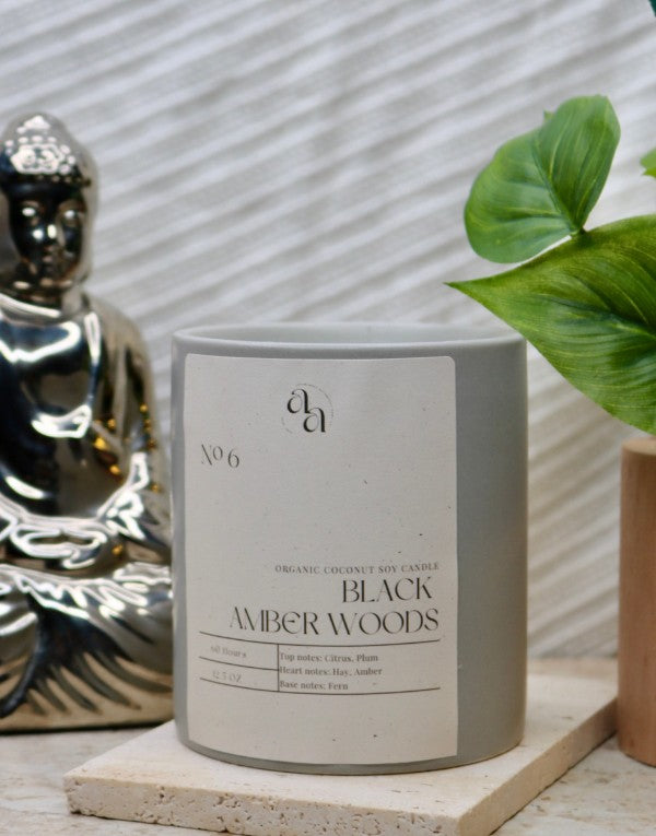 No. 6 Black Amber Woods coconut soy candle in a grey jar